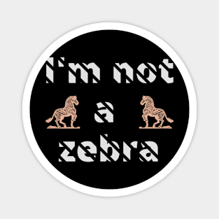 I'm not a zebra. White letters with a mask in the shape of diagonal stripes and two red zebras Magnet